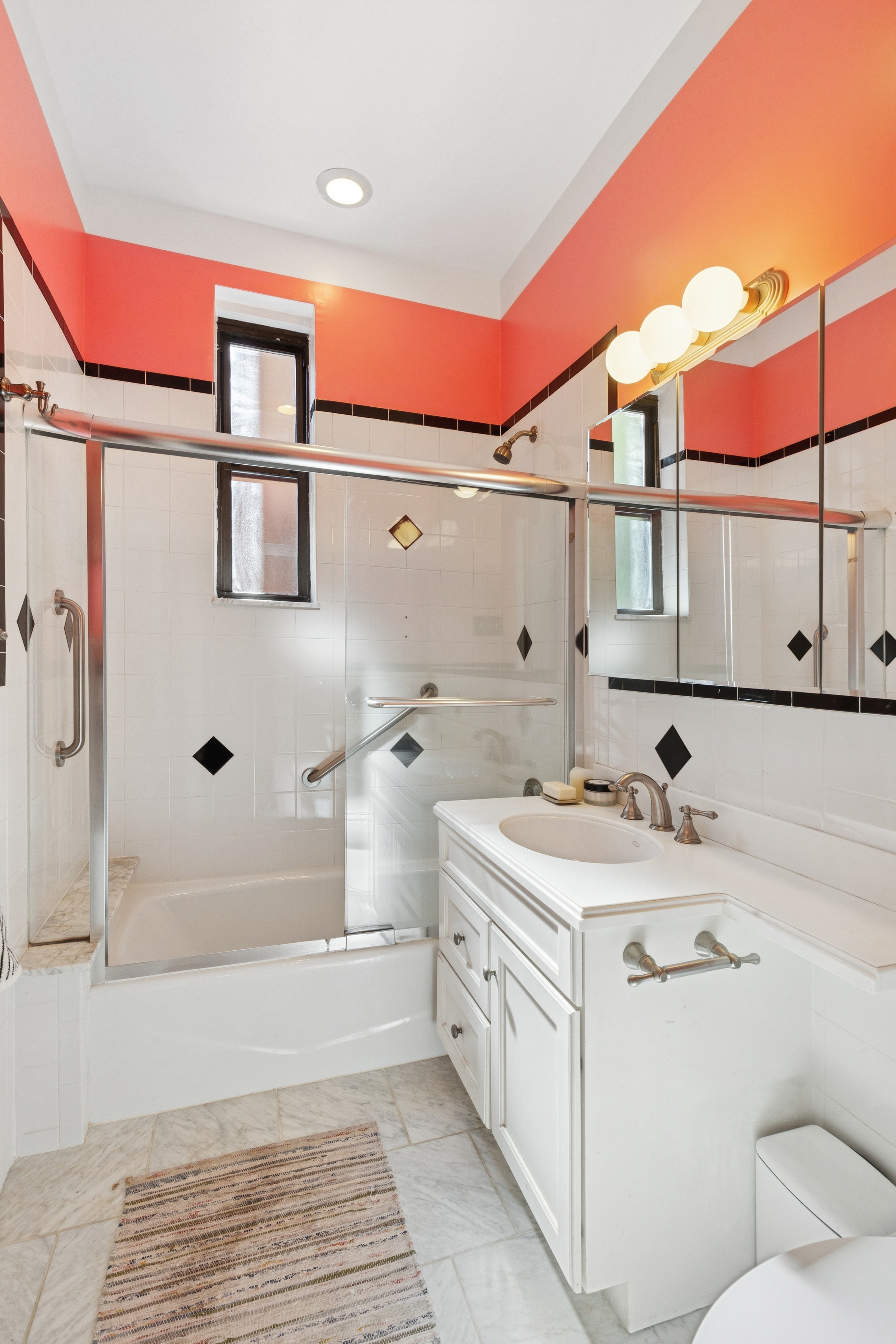 158-18 Riverside Drive West, Unit 2M Manhattan, NY 10032 - Photo 7 of 21 a bathroom with a sink a toilet and shower