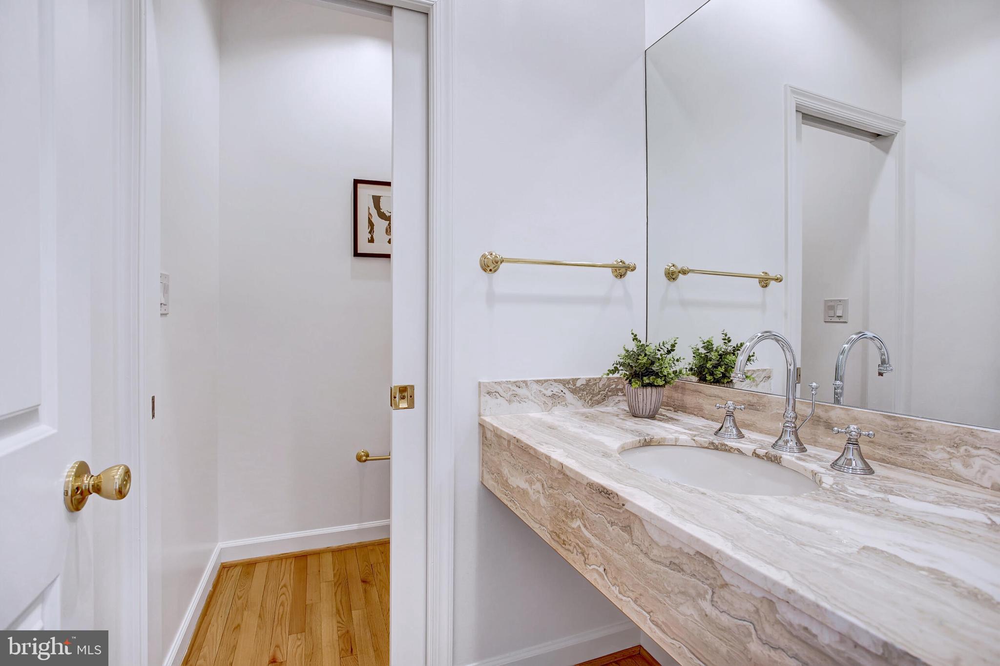 4709 Foxhall Crescent Northwest Washington, DC 20007 - Photo 24 of 57 a bathroom with a granite countertop sink and a mirror