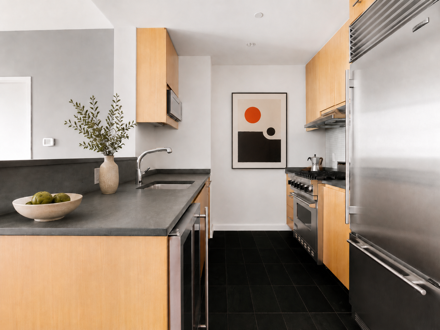 255 Hudson Street, Unit 7D Manhattan, NY 10013 - Photo 2 of 7 a kitchen with stainless steel appliances a sink stove and refrigerator
