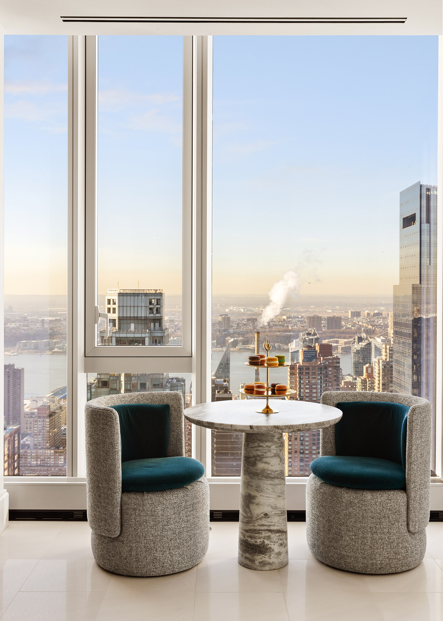 217 West 57th Street, Unit 60W Manhattan, NY 10019 - Photo 5 of 27 a living room with furniture a city view and a city view