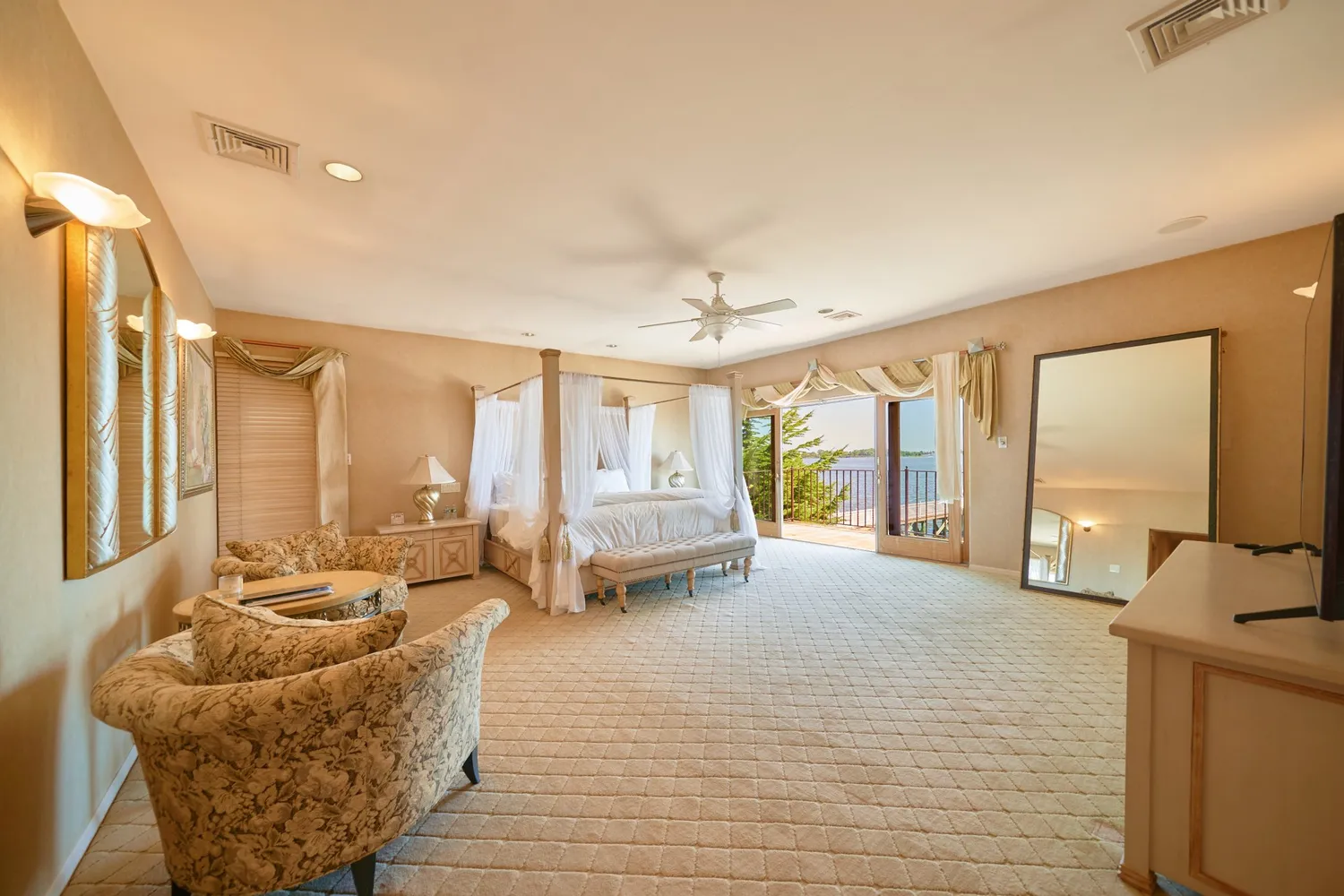 a bedroom with furniture and wooden floor