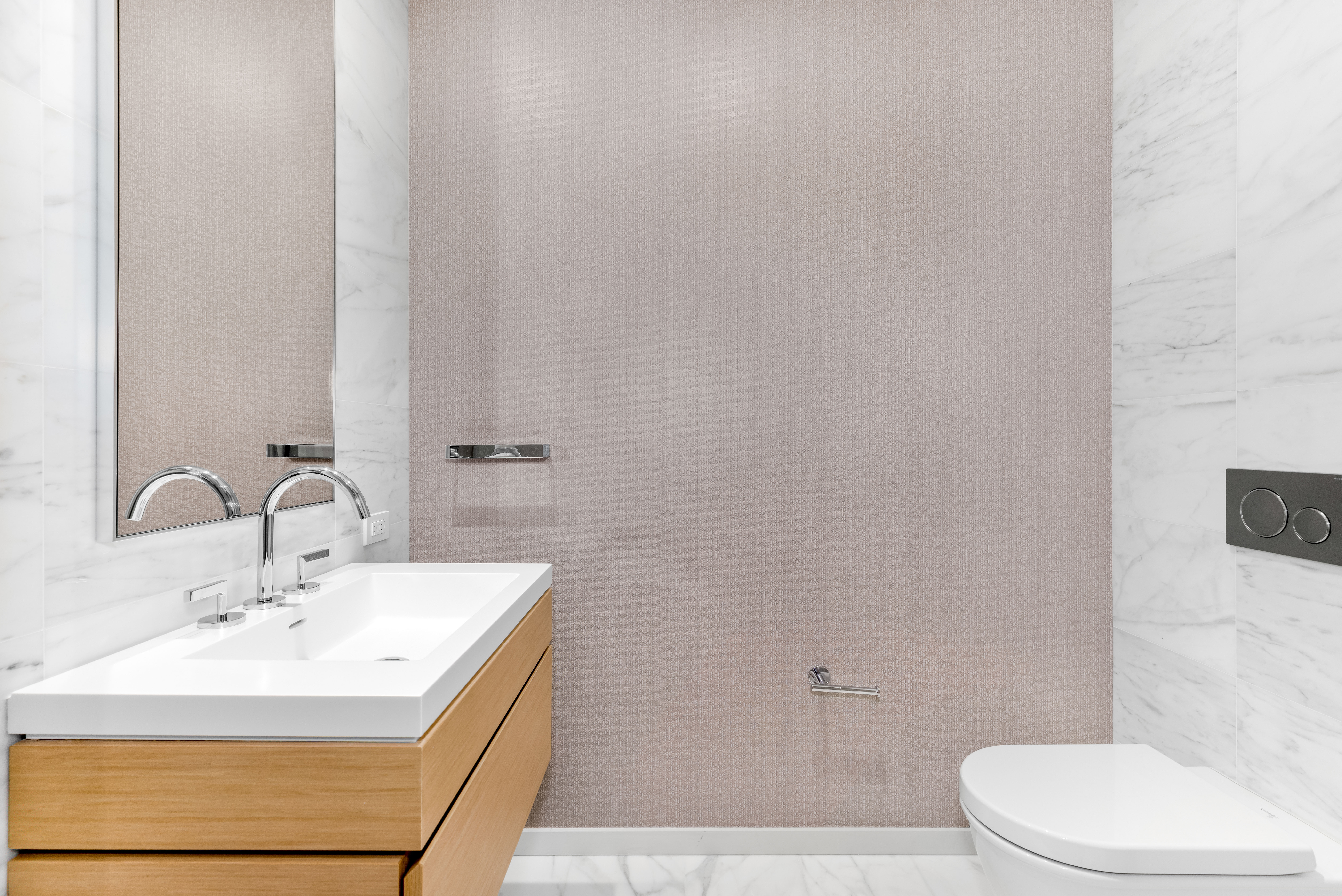 565 Broome Street, Unit N11D Manhattan, NY 10013 - Photo 7 of 18 a bathroom with a sink a toilet and a mirror