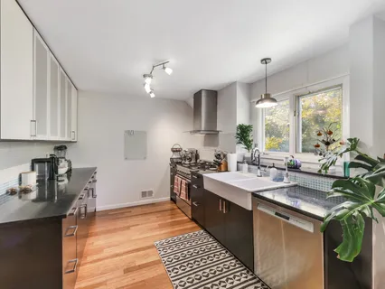 a kitchen with a sink and cabinets