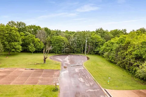a view of a swimming pool with an outdoor space and seating area