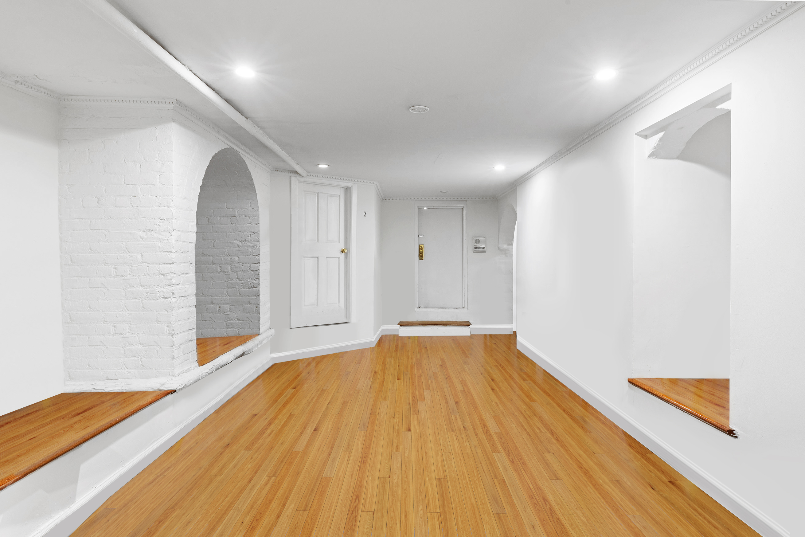 56 Joralemon Street Brooklyn, NY 11201 - Photo 16 of 18 a view of an empty room with wooden floor