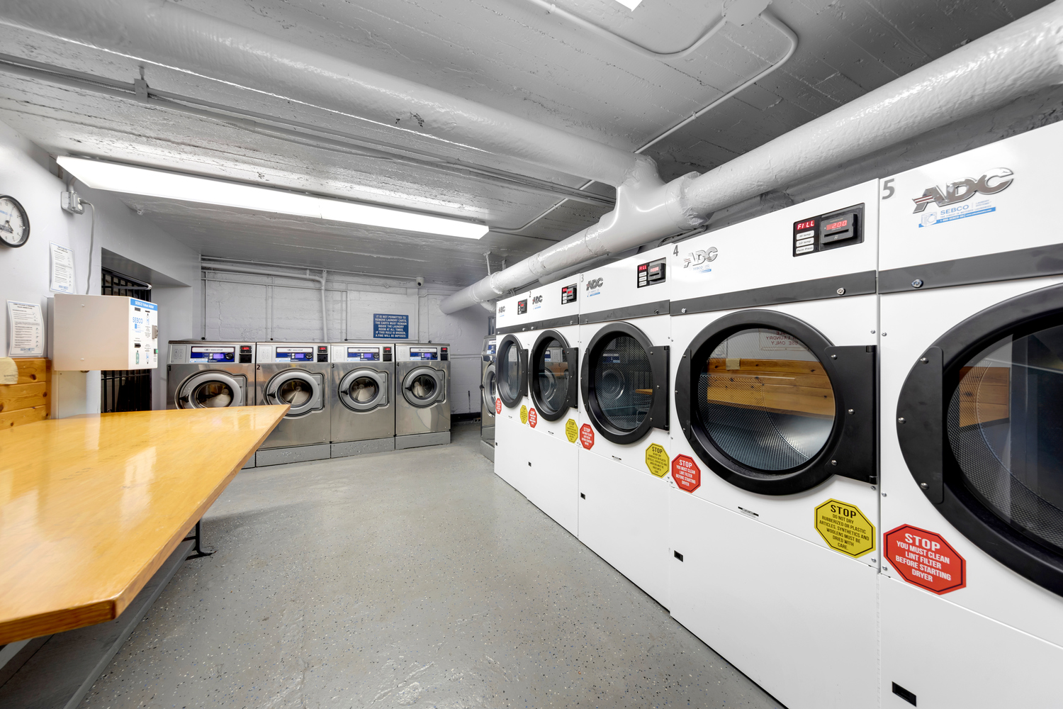 37-20 83rd Street, Unit 6J Queens, NY 11372 - Photo 13 of 14 a utility room with cars and parked cars