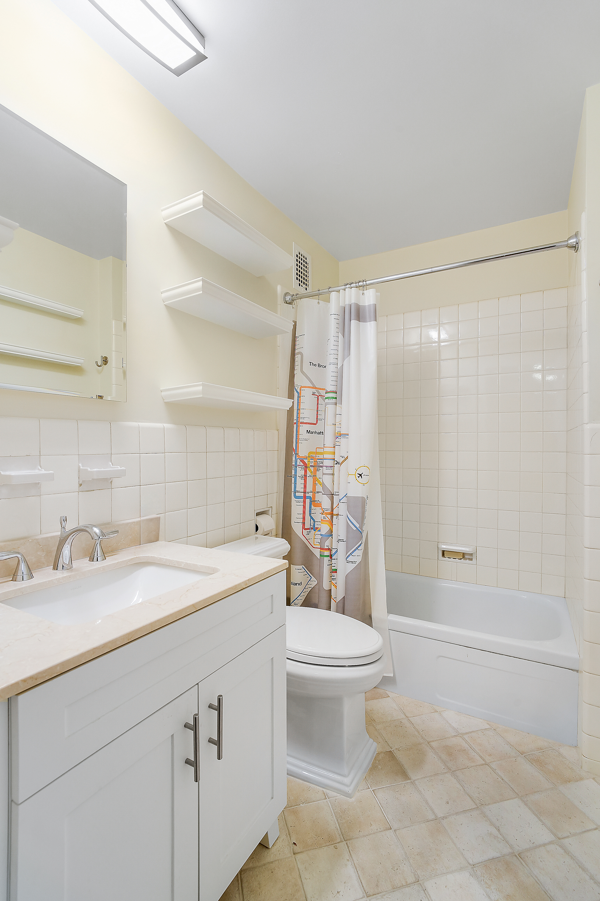 475 Park Avenue, Unit 3D5 Manhattan, NY 10022 - Photo 12 of 18 a bathroom with a sink toilet and shower