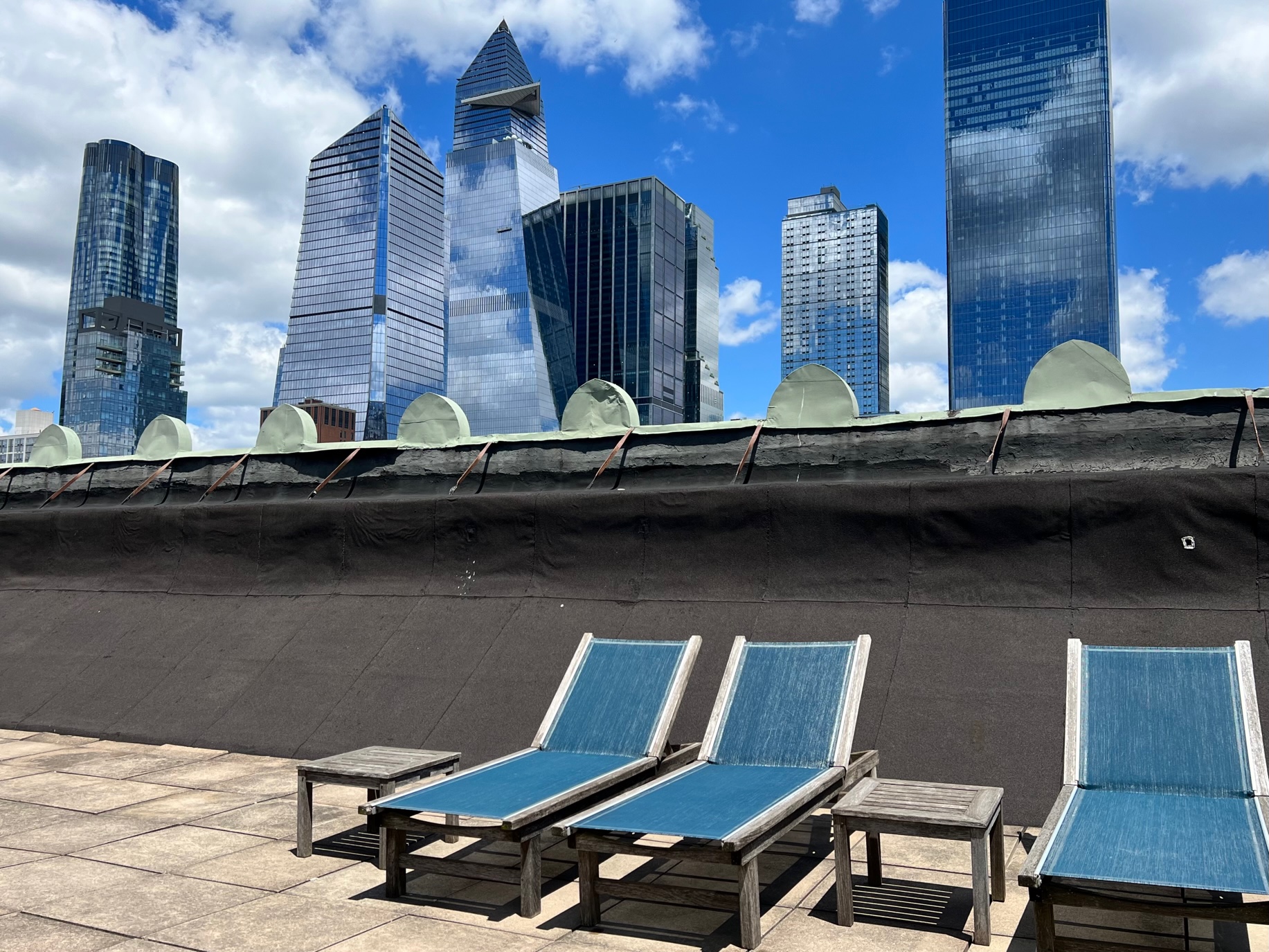 263 9th Avenue, Unit 3D Manhattan, NY 10001 - Photo 12 of 15 a couple of chairs that are sitting in a backyard