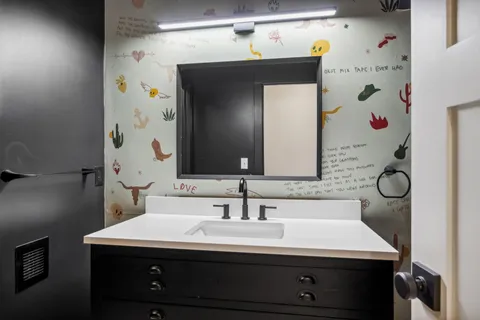 a bathroom with a sink and a mirror