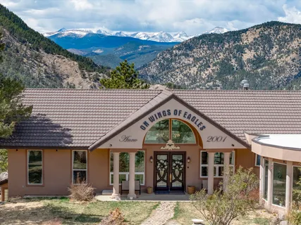 a front view of a house with large windows
