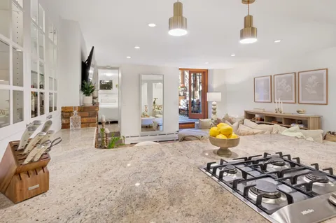 a view of a kitchen and dining area