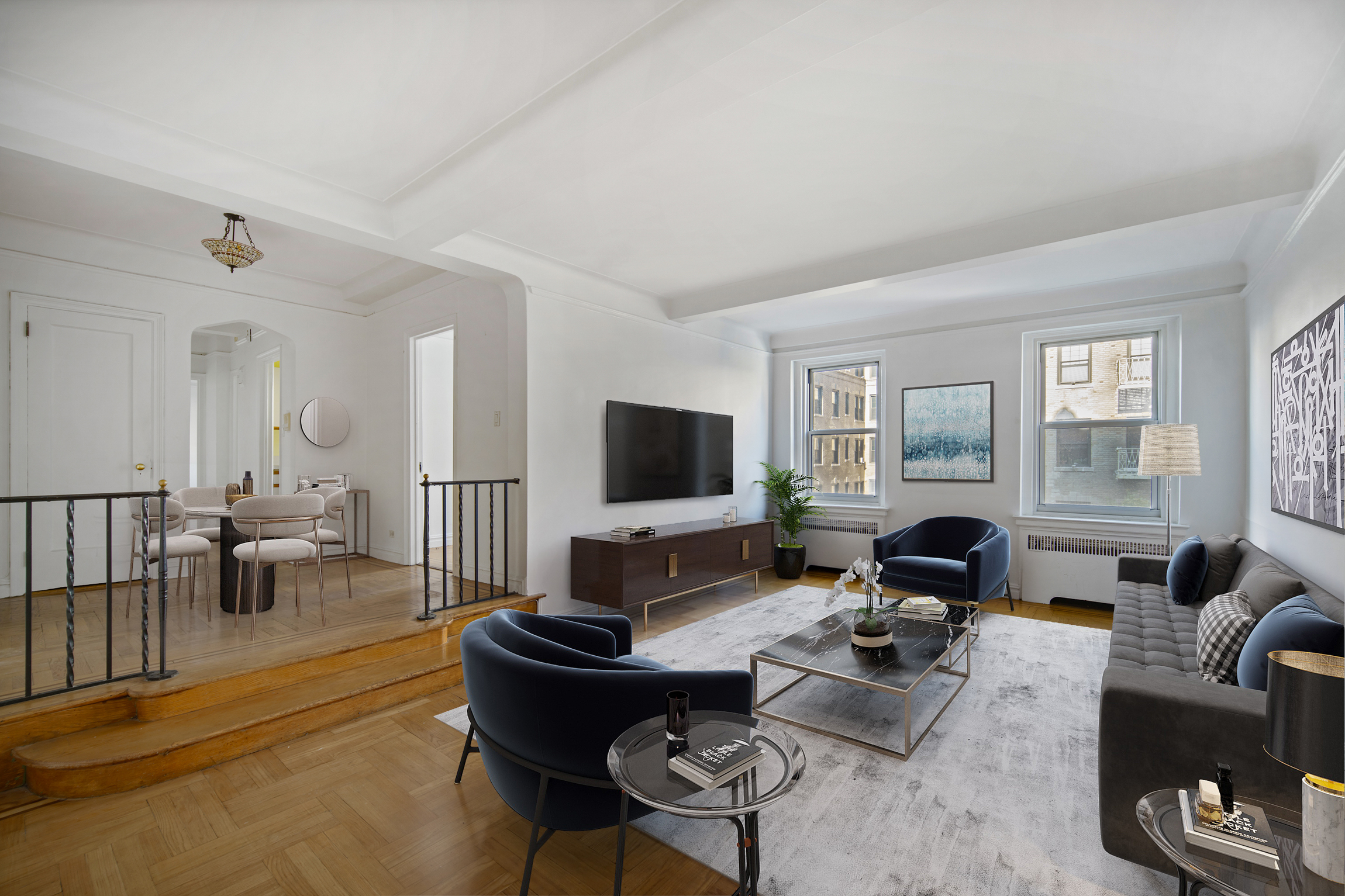 a living room with furniture and a flat screen tv