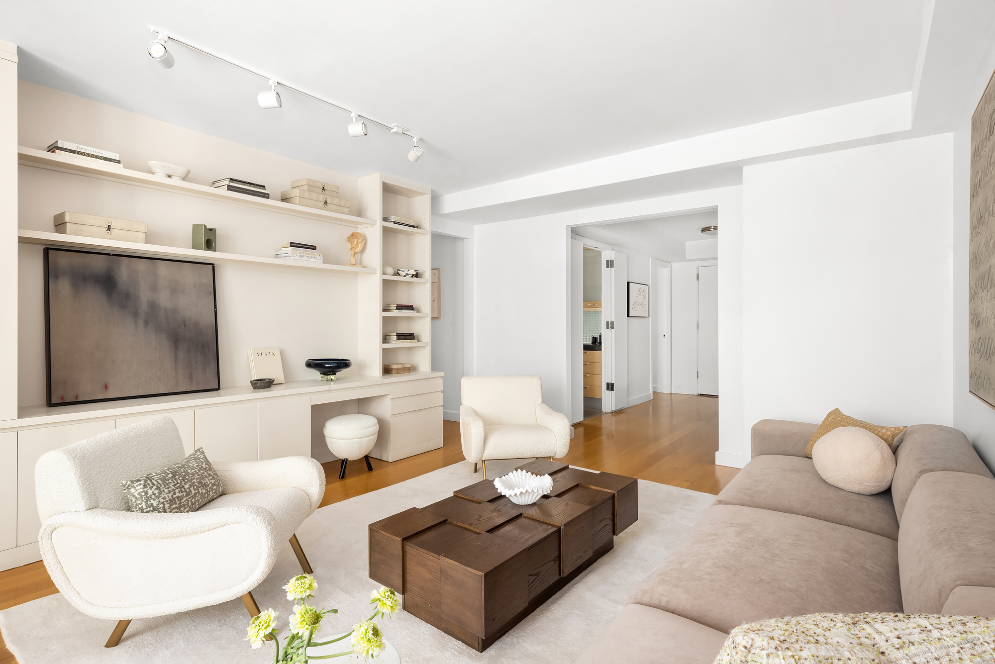408 East 79th Street, Unit 14B Manhattan, NY 10075 - Photo 4 of 18 a living room with furniture and a flat screen tv