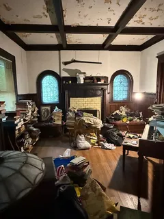 a room with lots of residential furniture and a wooden floor