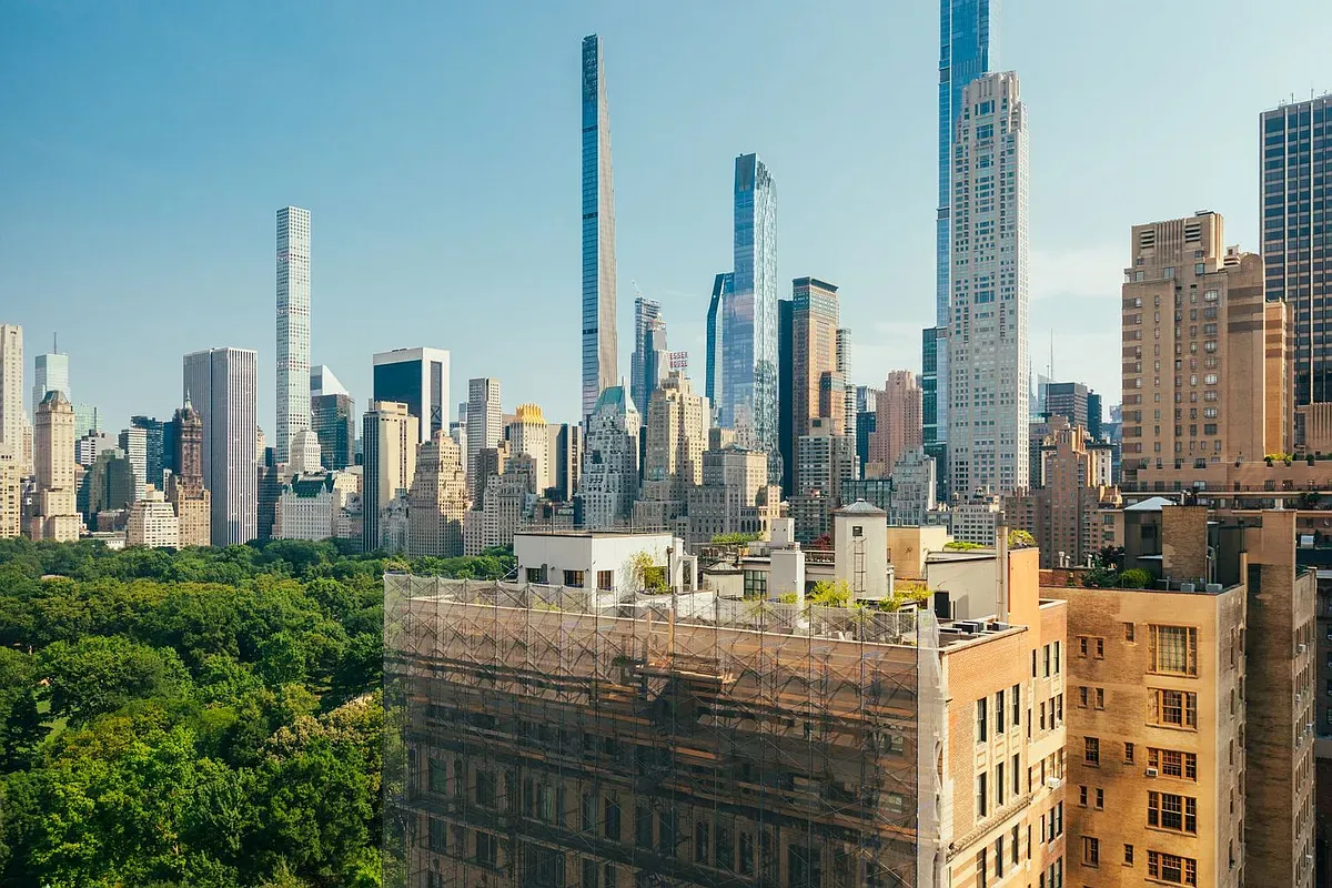 a large body of water with a tall building