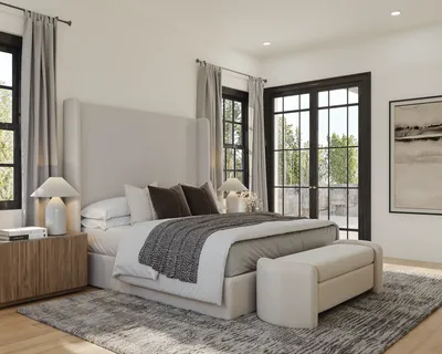 a bedroom with a bed and a couch