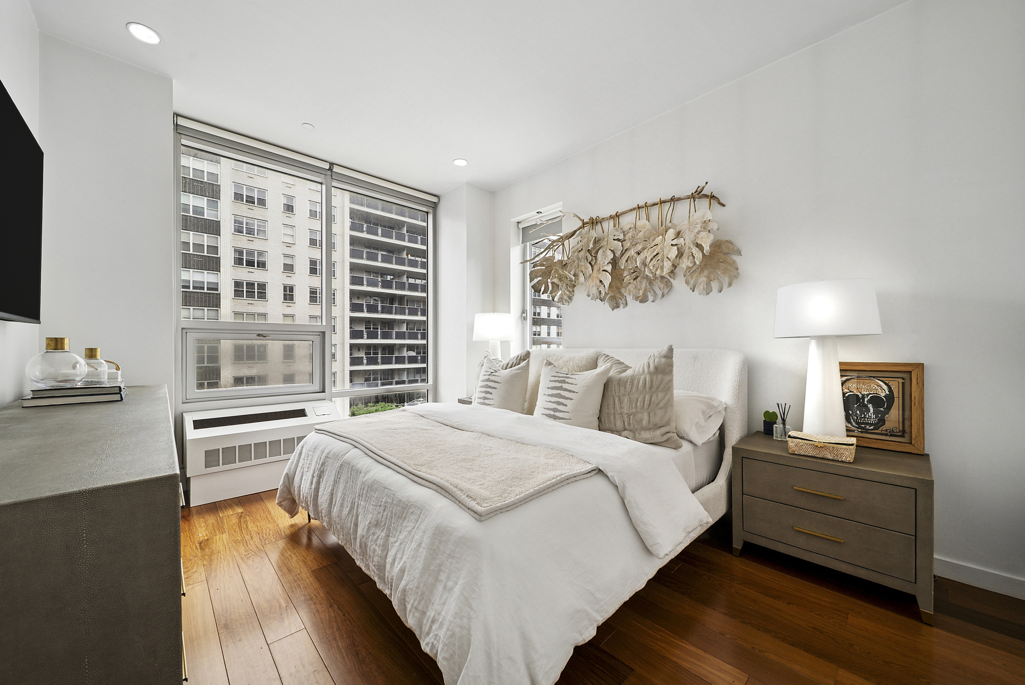 148 East 19th Street, Unit 4B Manhattan, NY 10003 - Photo 4 of 10 a bedroom with a bed and wooden floor