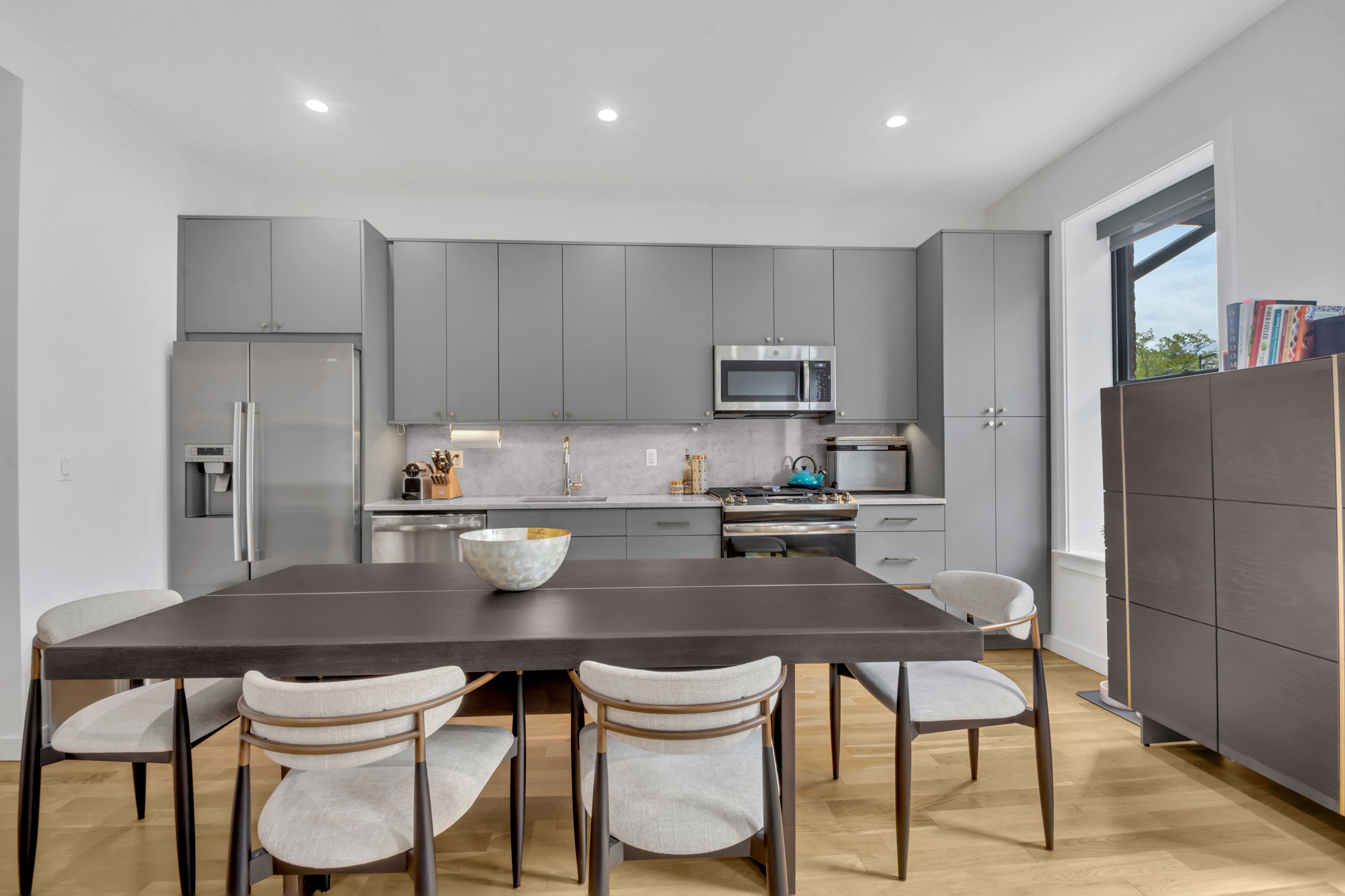 362 13th Street, Unit 3 Brooklyn, NY 11215 - Photo 10 of 12 a kitchen with a dining table chairs and refrigerator