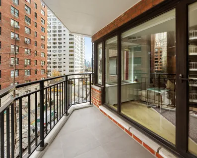 a view of balcony with a glass door