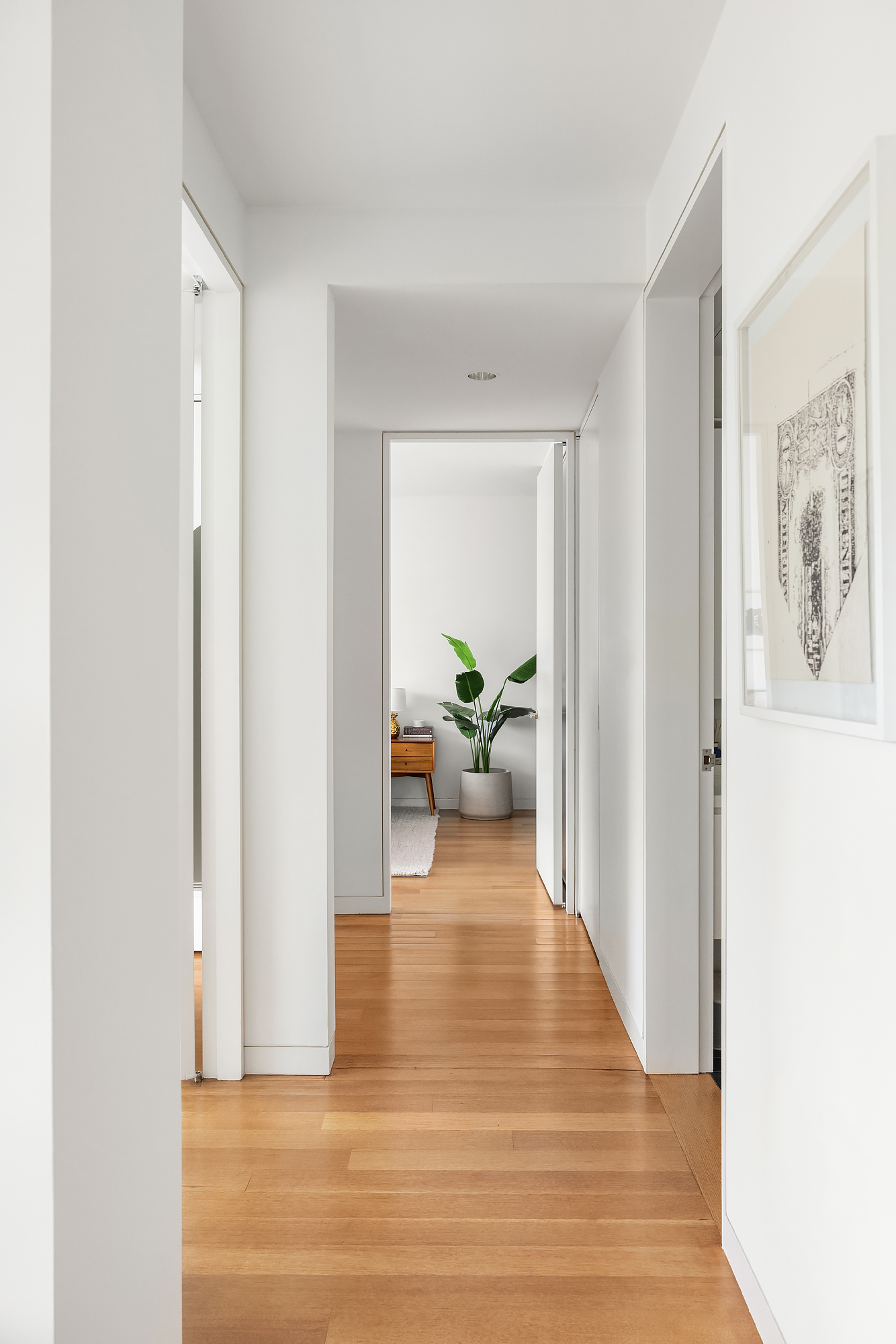1 Grand Army Plaza, Unit 3C Brooklyn, NY 11238 - Photo 7 of 23 a view of a hallway view with wooden floor and a living room