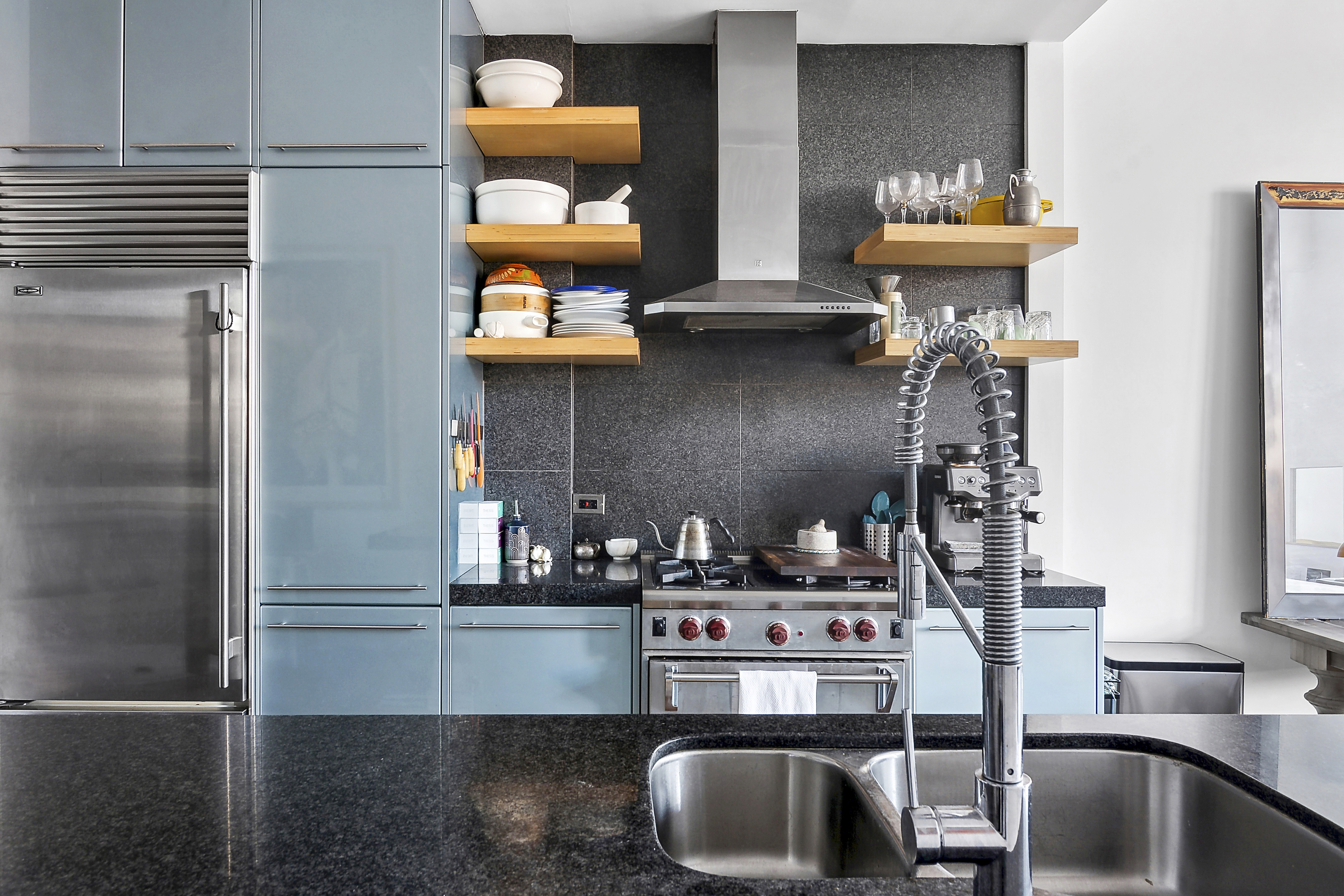 60 Broadway, Unit 2K Brooklyn, NY 11249 - Photo 4 of 7 a kitchen with a refrigerator and a stove