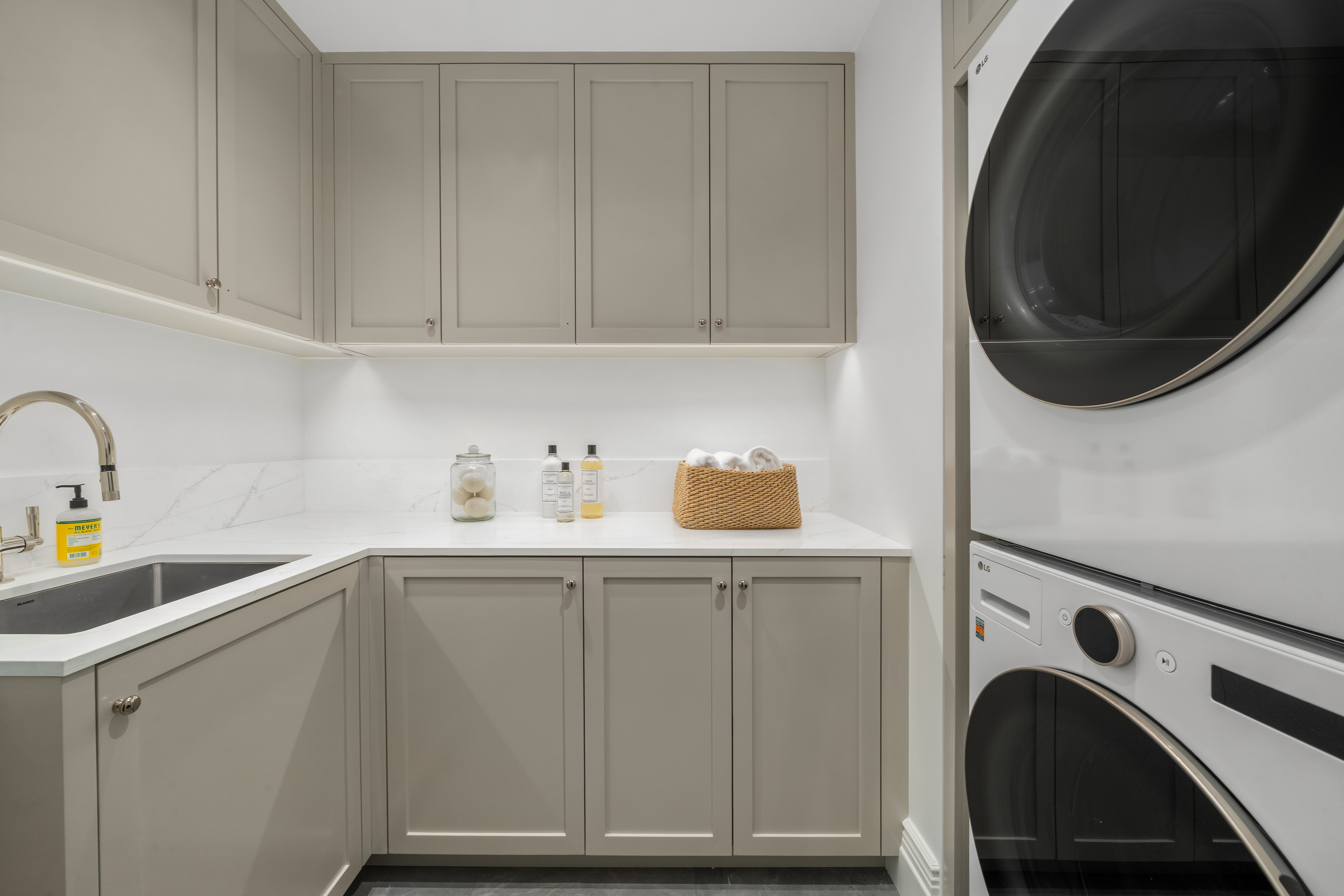 1020 5th Avenue, Unit 9 Manhattan, NY 10028 - Photo 26 of 27 a utility room with sink dryer and washer