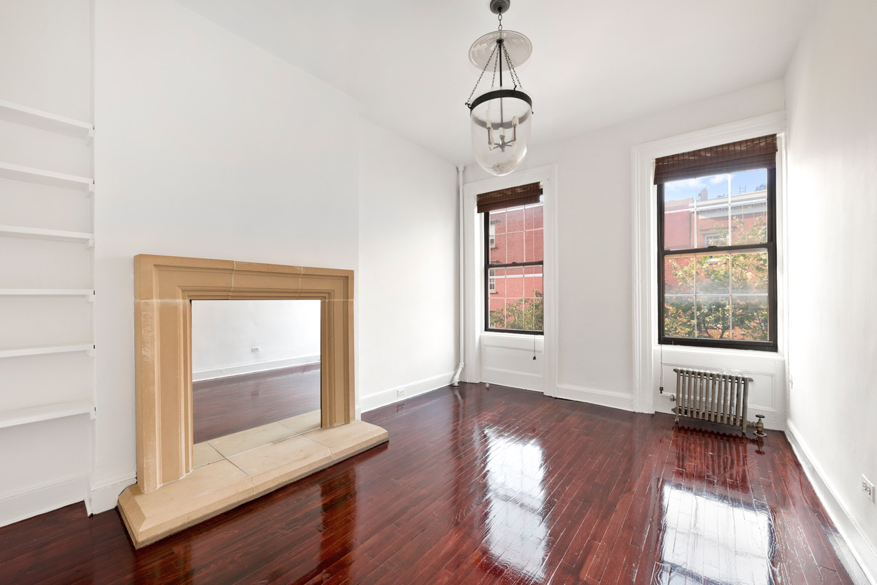 54 Jane Street Manhattan, NY 10014 - Photo 2 of 26 a view of room with window and wooden floor