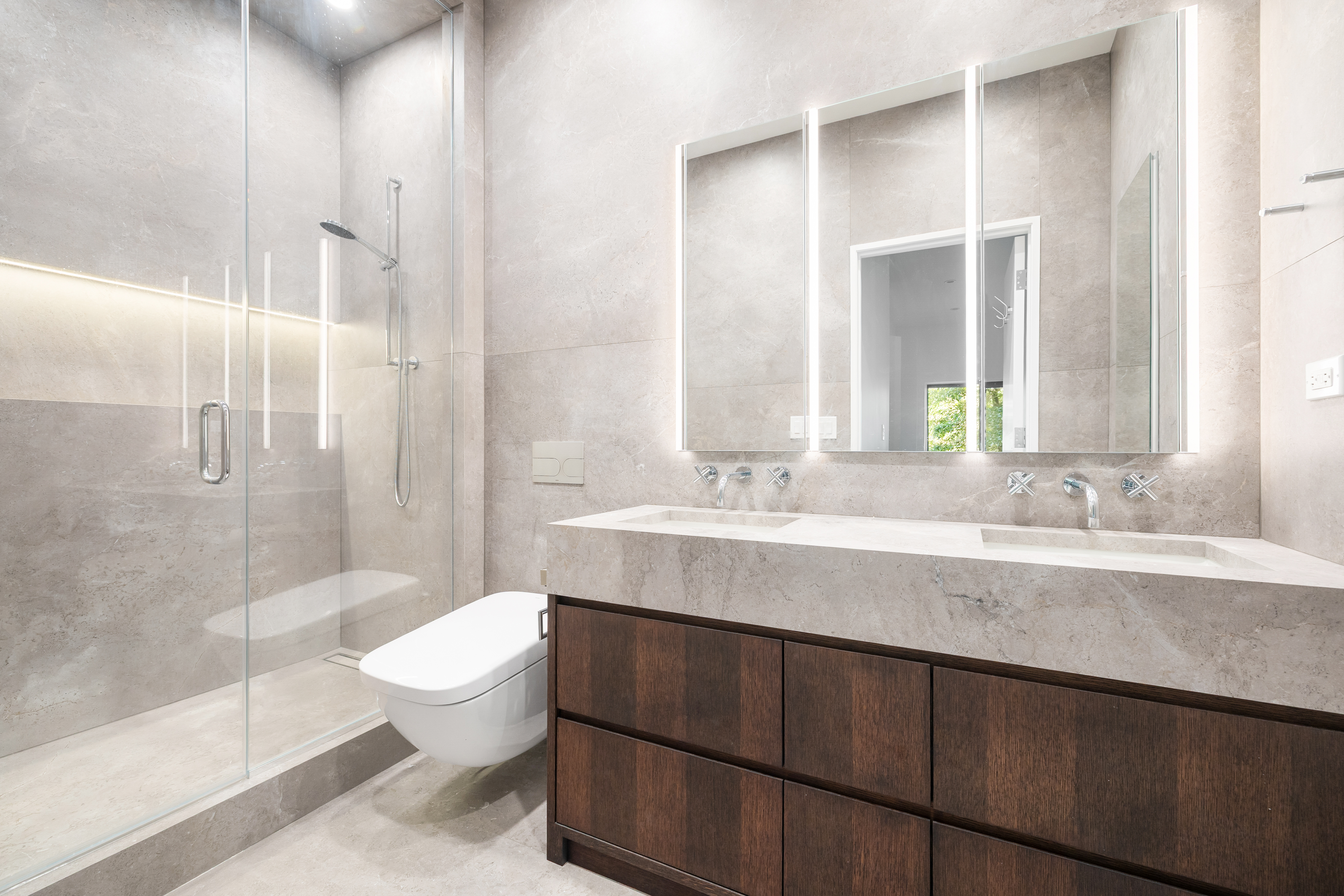 69 Bank Street, Unit 203 Manhattan, NY 10014 - Photo 17 of 23 a bathroom with a sink toilet and shower