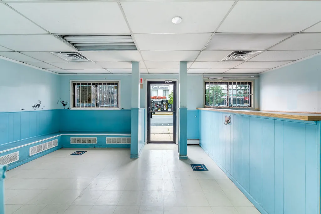 a view of a hallway with windows