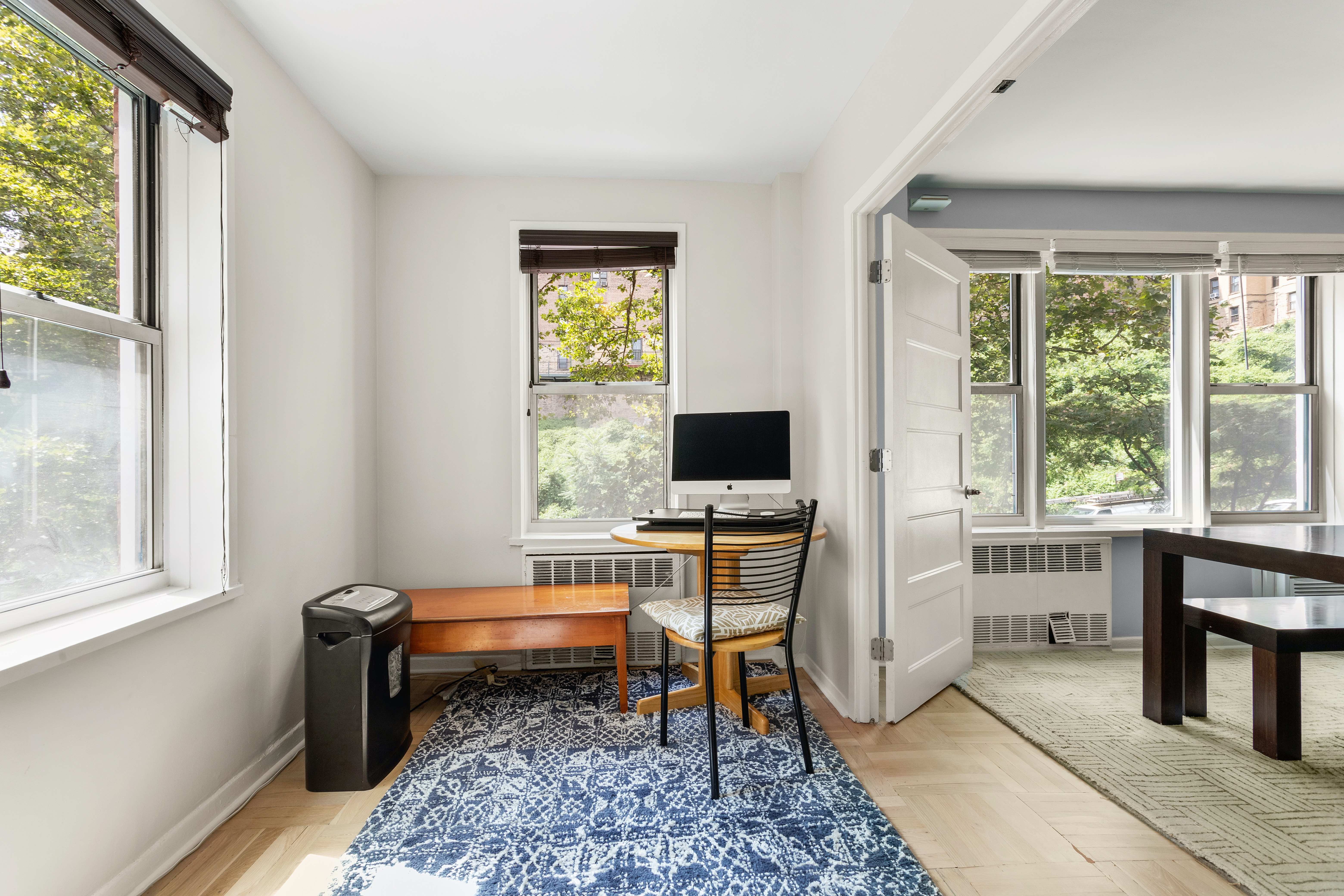 66 Overlook Terrace, Unit 4K Manhattan, NY 10040 - Photo 5 of 26 a view of a workspace with furniture and a window