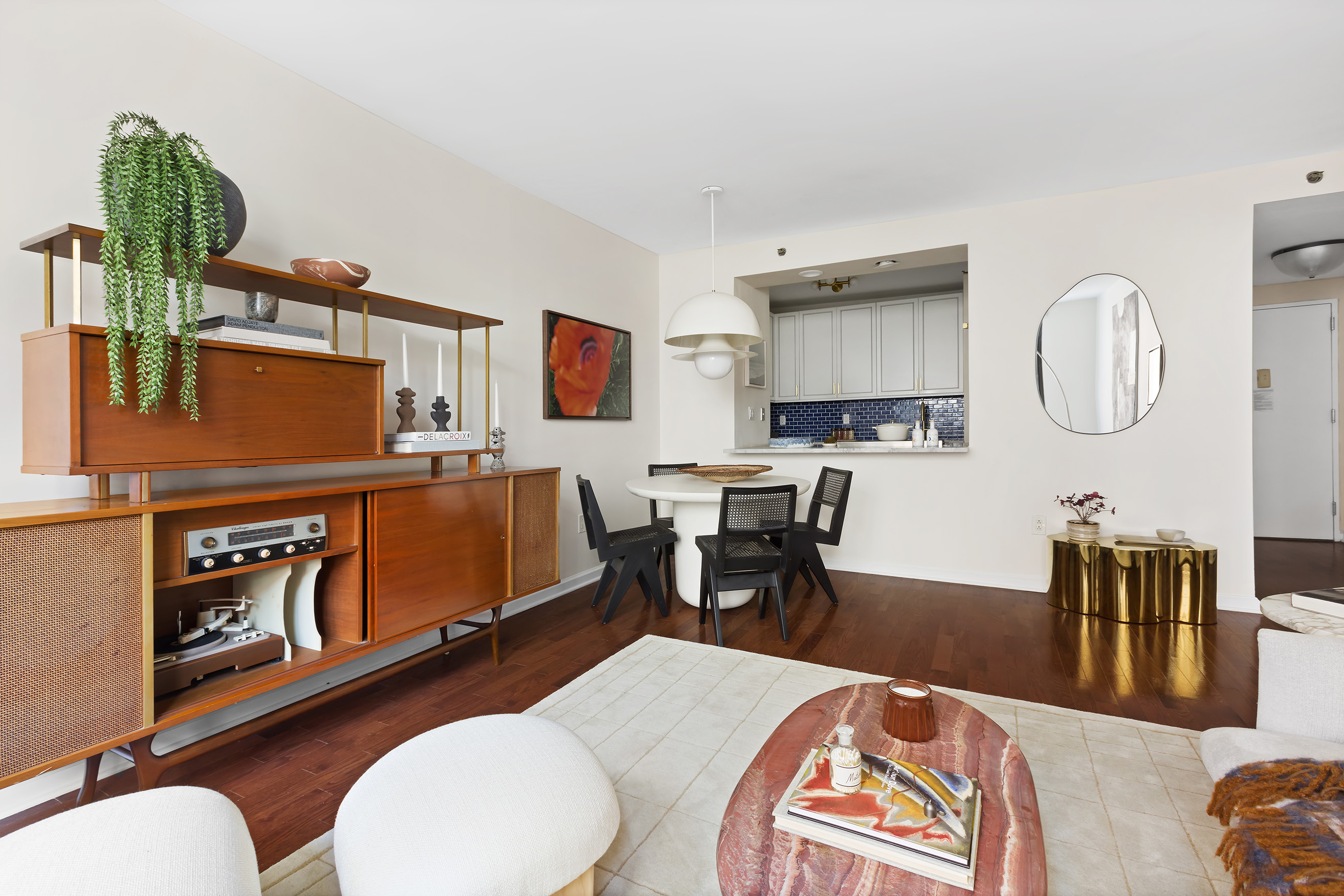 199 Bowery, Unit 3D Manhattan, NY 10002 - Photo 3 of 11 a living room with furniture a rug and a painting on the wall