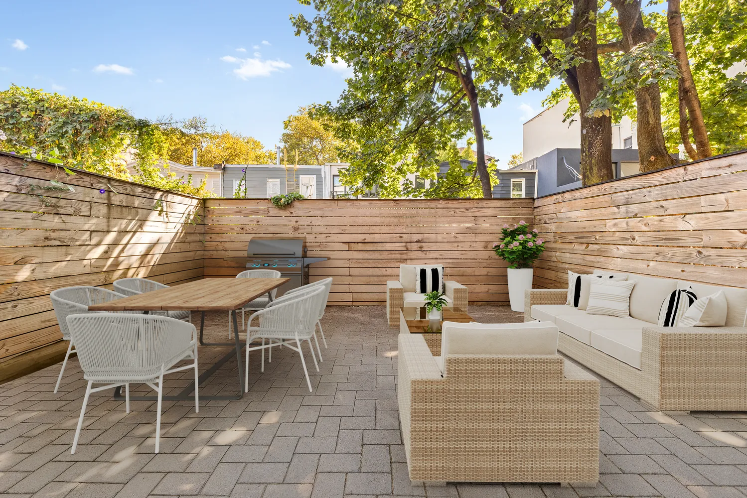 a view of a patio with couches and potted plants