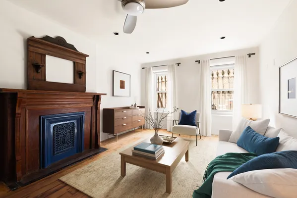 a living room with furniture and a fireplace