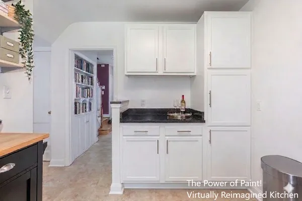 a kitchen with granite countertop white cabinets and white appliances