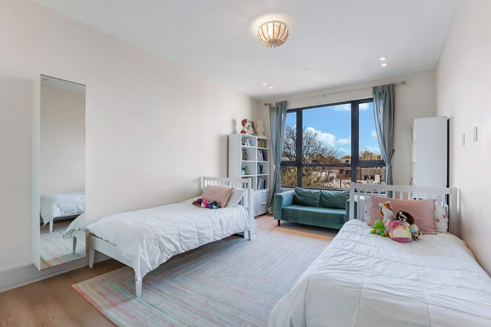 288 19th Street, Unit 3 Brooklyn, NY 11215 - Photo 15 of 26 a bedroom with a bed and large window