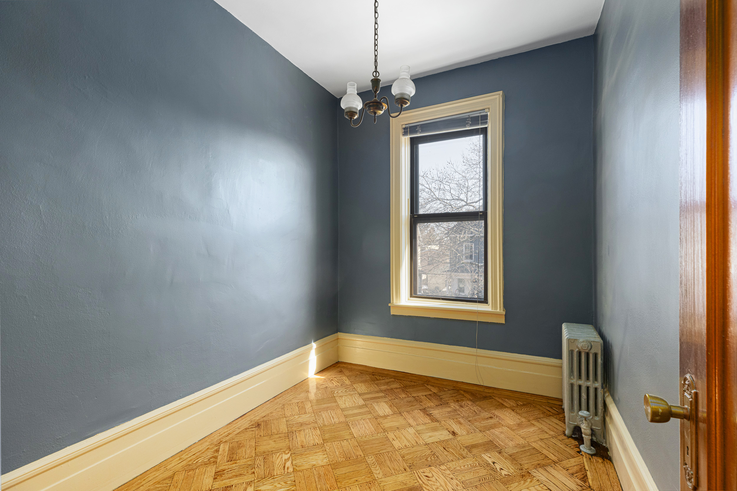 304 East 8th Street Brooklyn, NY 11218 - Photo 10 of 32 a view of an empty room and window