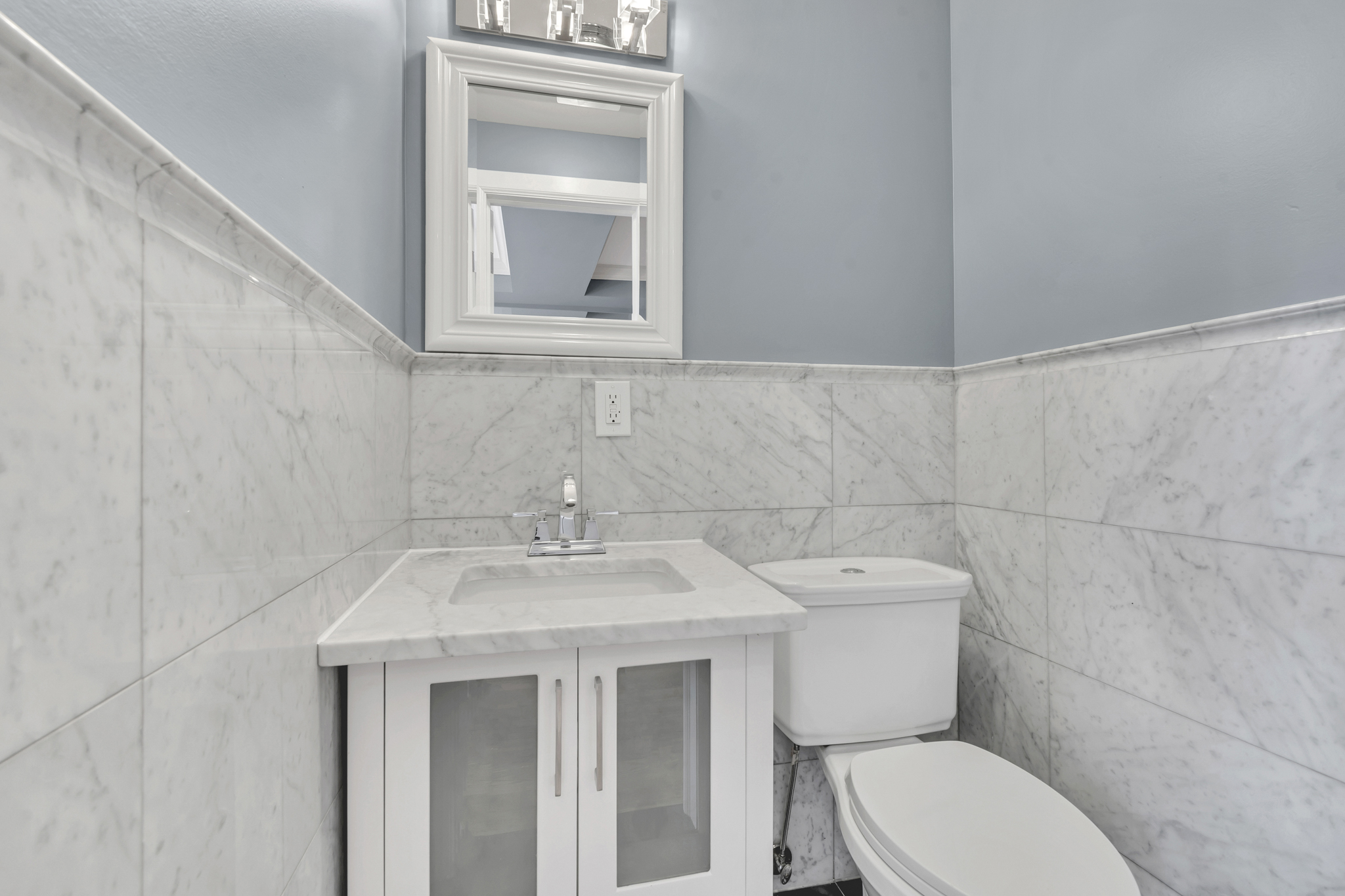 28 Roosevelt Place, Unit 2 Brooklyn, NY 11233 - Photo 3 of 12 a bathroom with a toilet sink and mirror