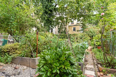 a view of a house with a tree