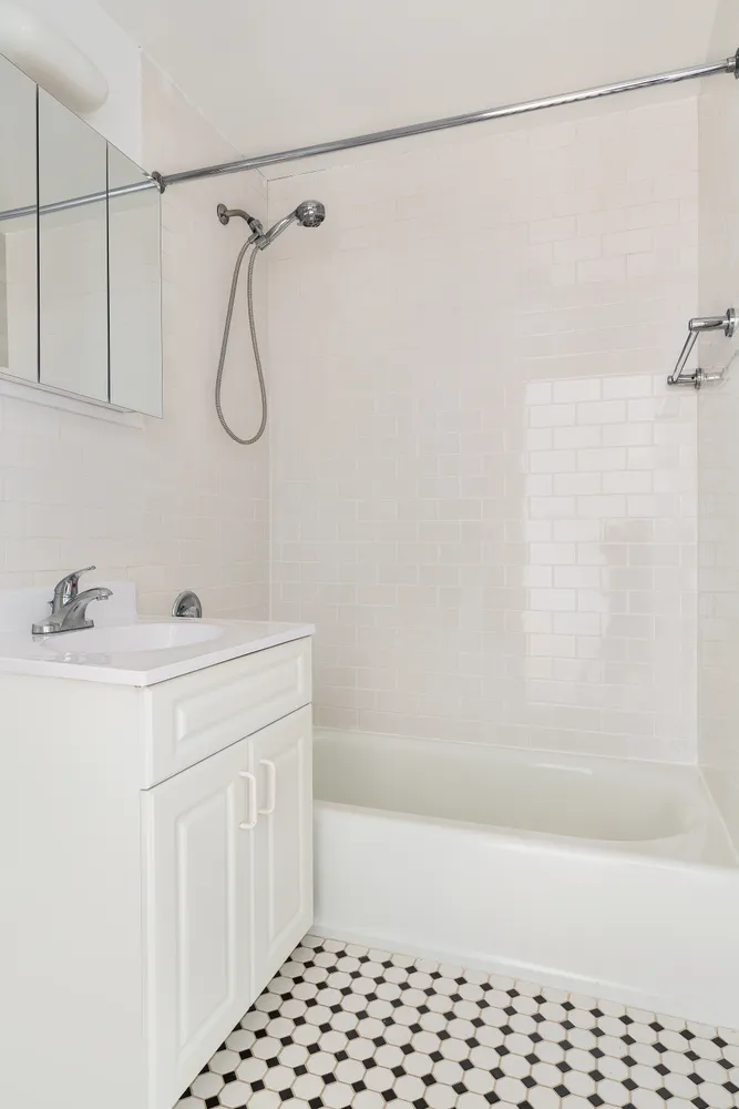 a bathroom with a sink a vanity and a shower