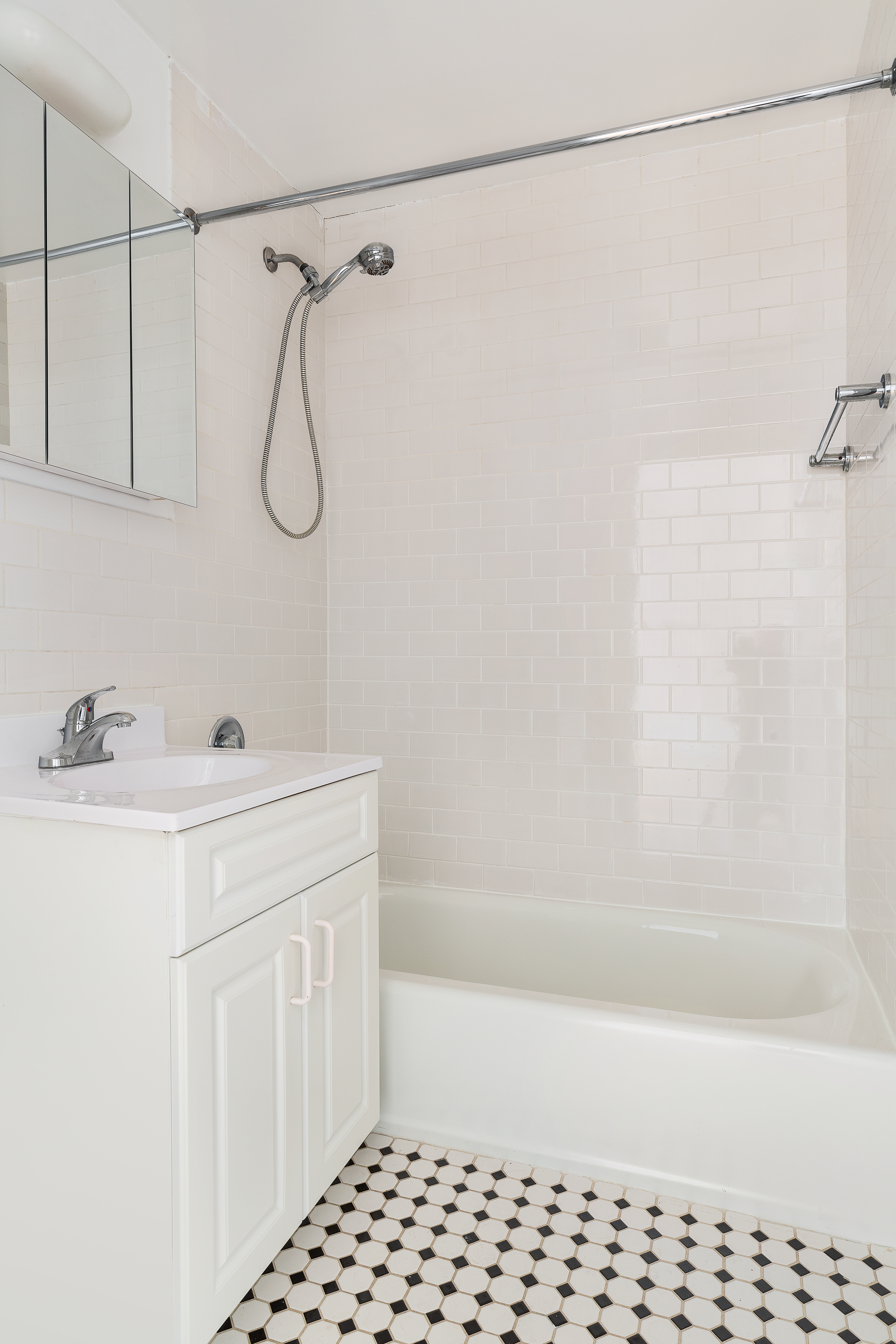 60 West 14th Street, Unit 7C Manhattan, NY 10011 - Photo 5 of 10 a bathroom with a sink a vanity and a shower