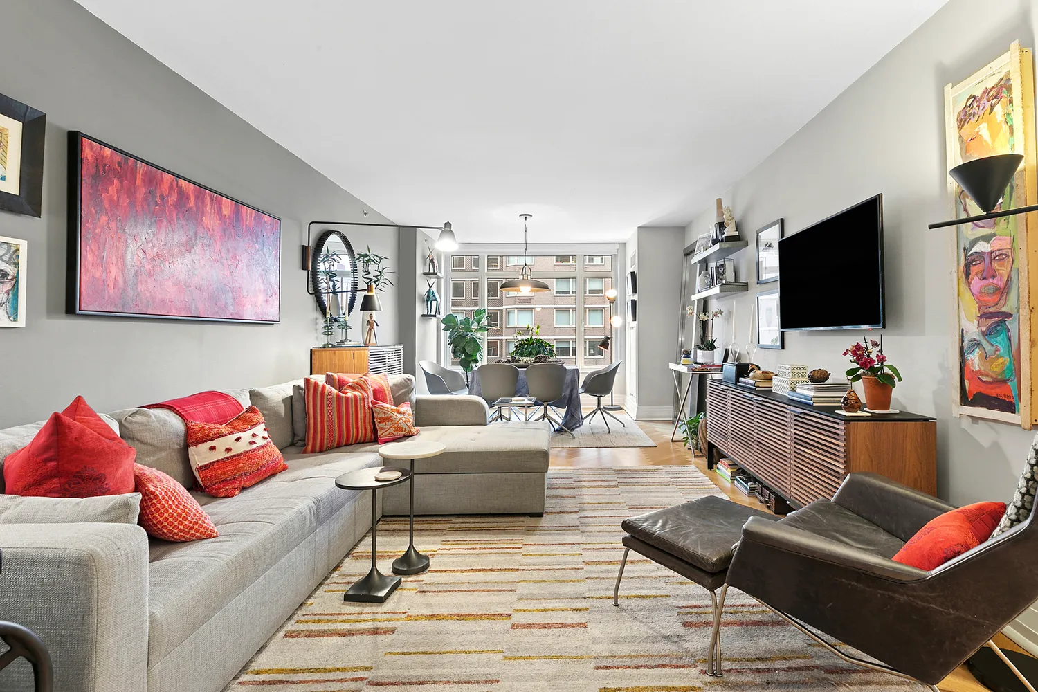 a living room with furniture and a flat screen tv
