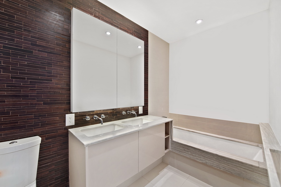 2 Northside Piers, Unit 27P Brooklyn, NY 11249 - Photo 10 of 19 a bathroom with a sink and a mirror