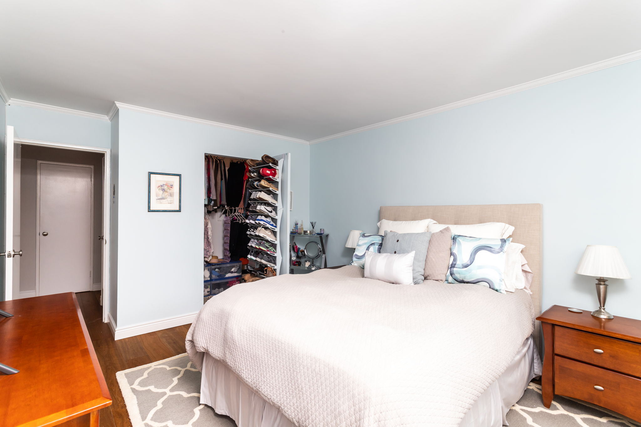 415 East 85th Street, Unit 5J Manhattan, NY 10028 - Photo 12 of 19 a bedroom with a bed and wooden floor