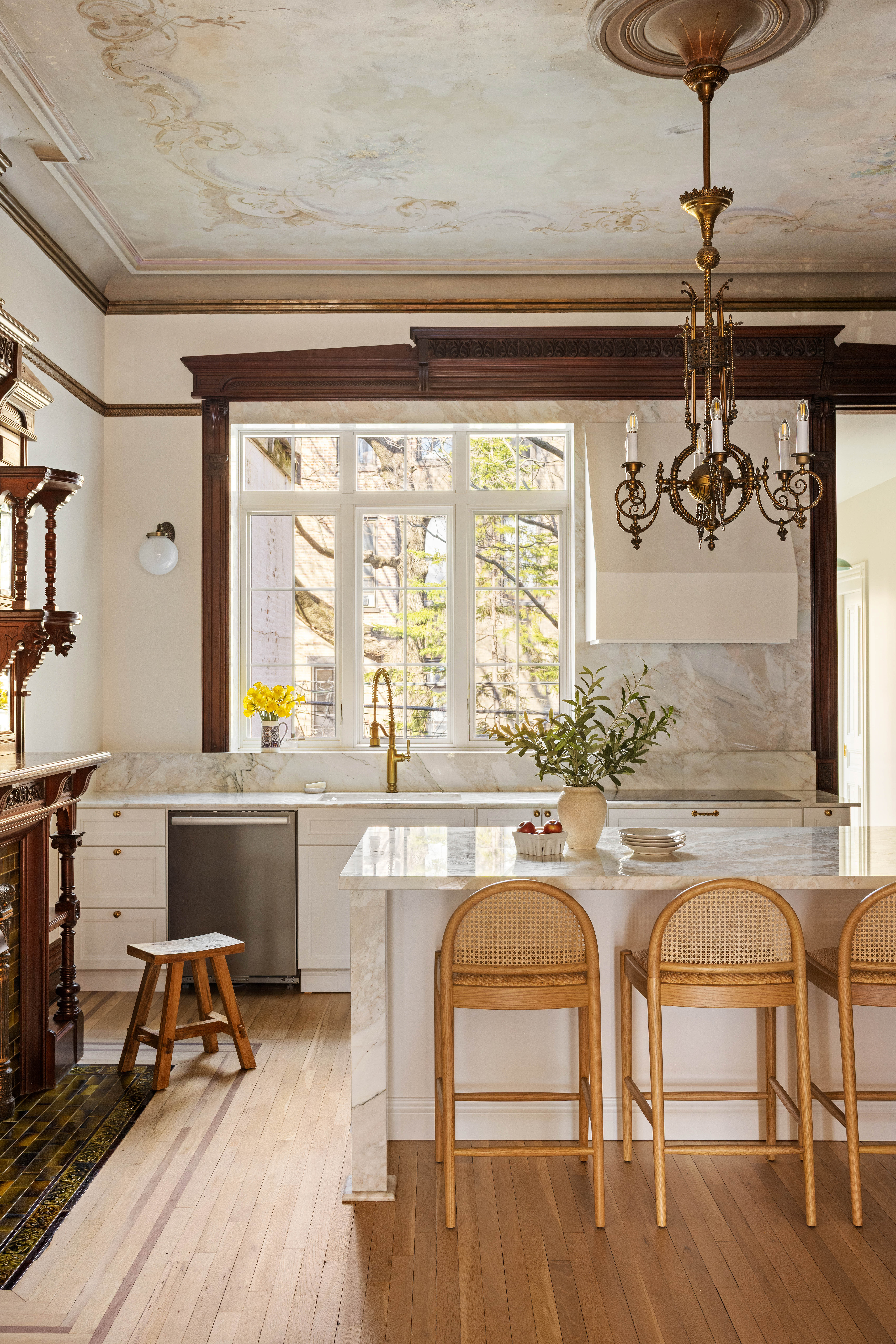 787 Carroll Street Brooklyn, NY 11215 - Photo 5 of 32 a kitchen with a table chairs and wooden floor