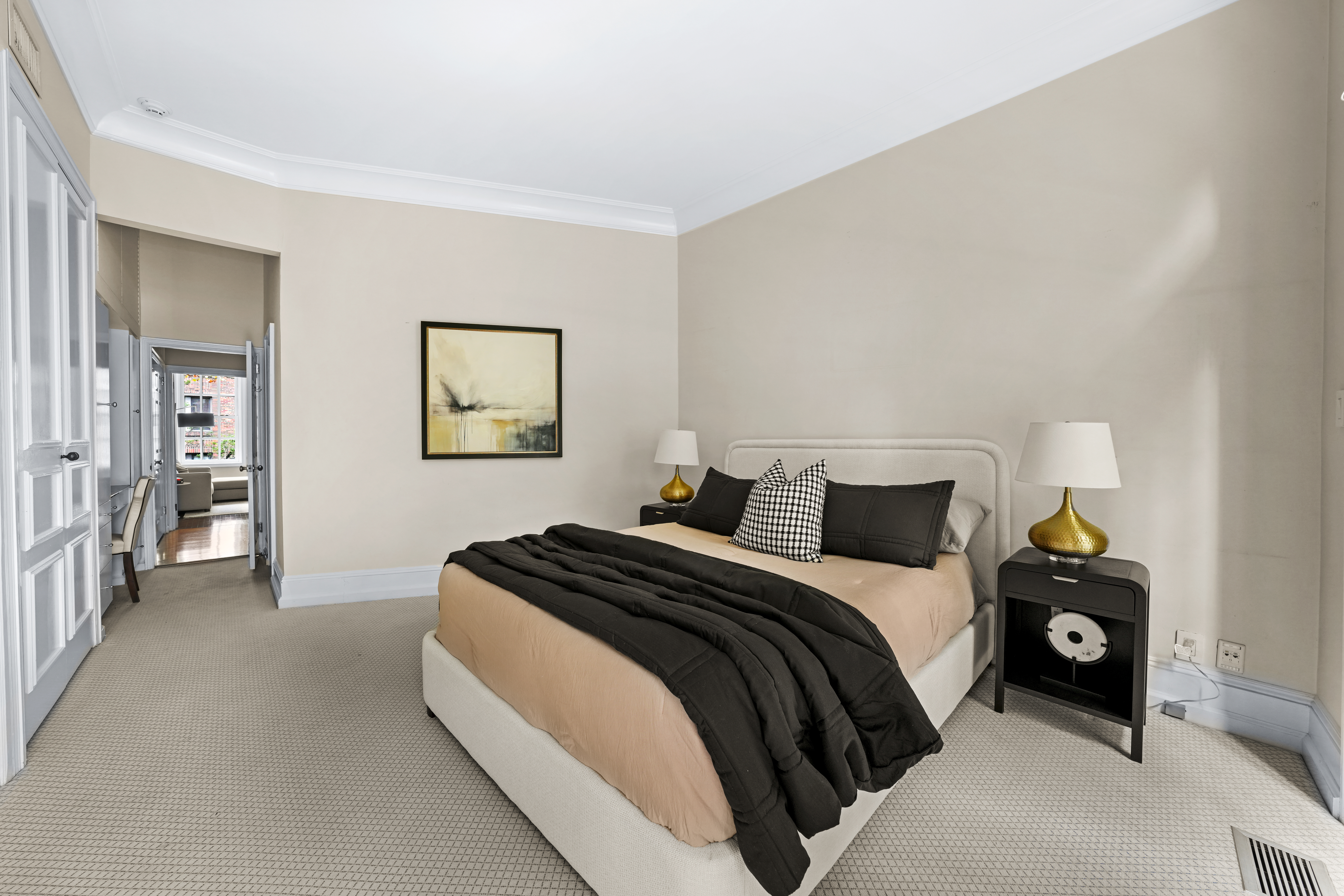 247 East 71st Street Manhattan, NY 10021 - Photo 16 of 31 a bedroom with a bed and a lamp