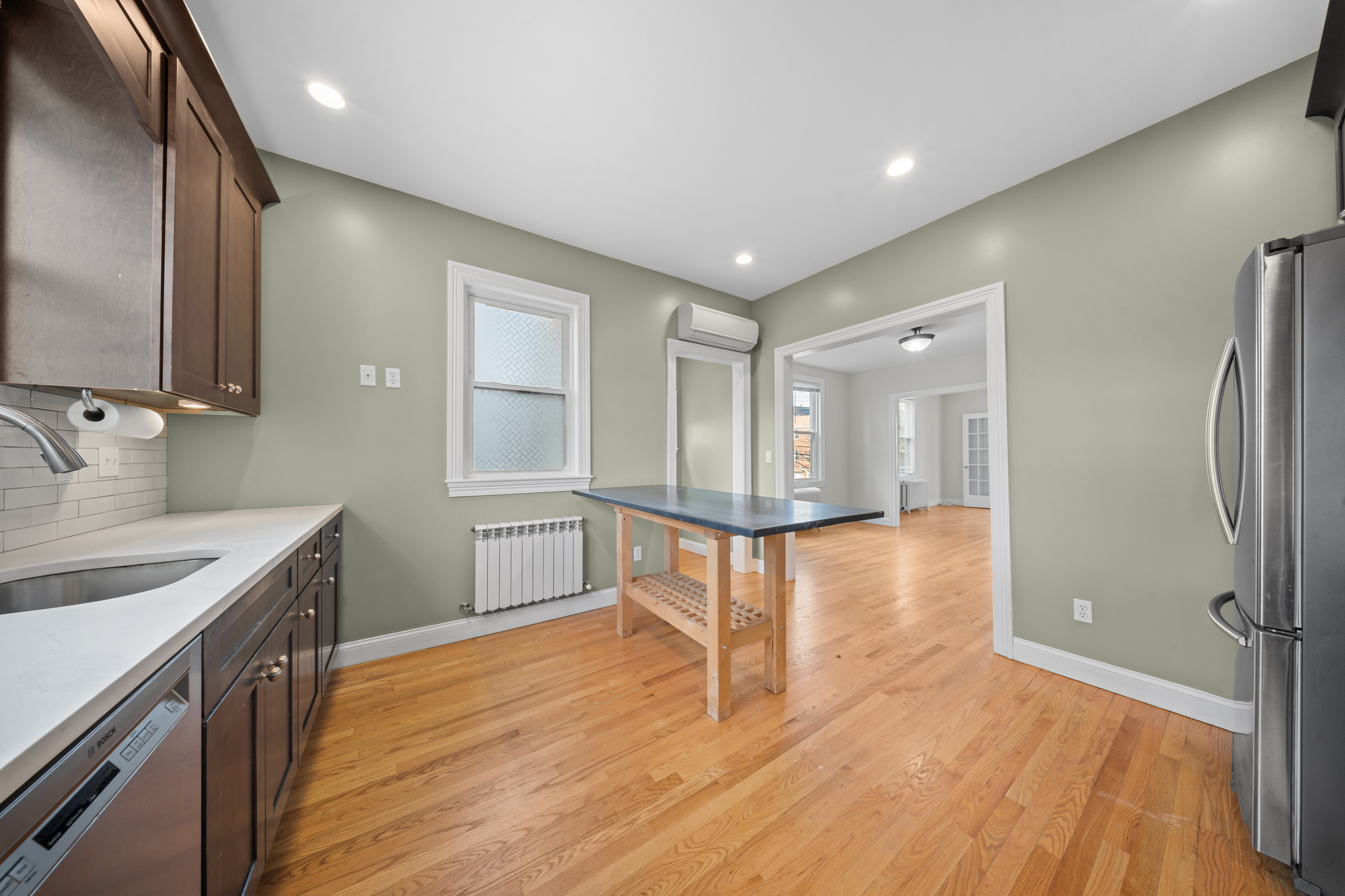 52-19 69th Street Queens, NY 11378 - Photo 6 of 35 a bathroom with a sink and a mirror