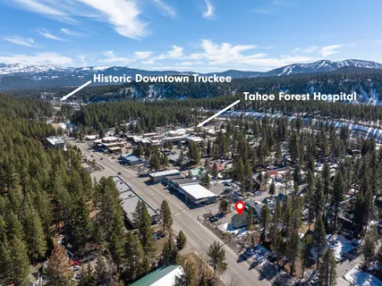 a view of a house with a tree