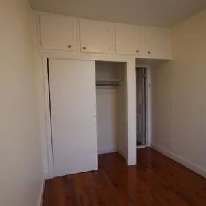 a view of cabinets with wooden floor
