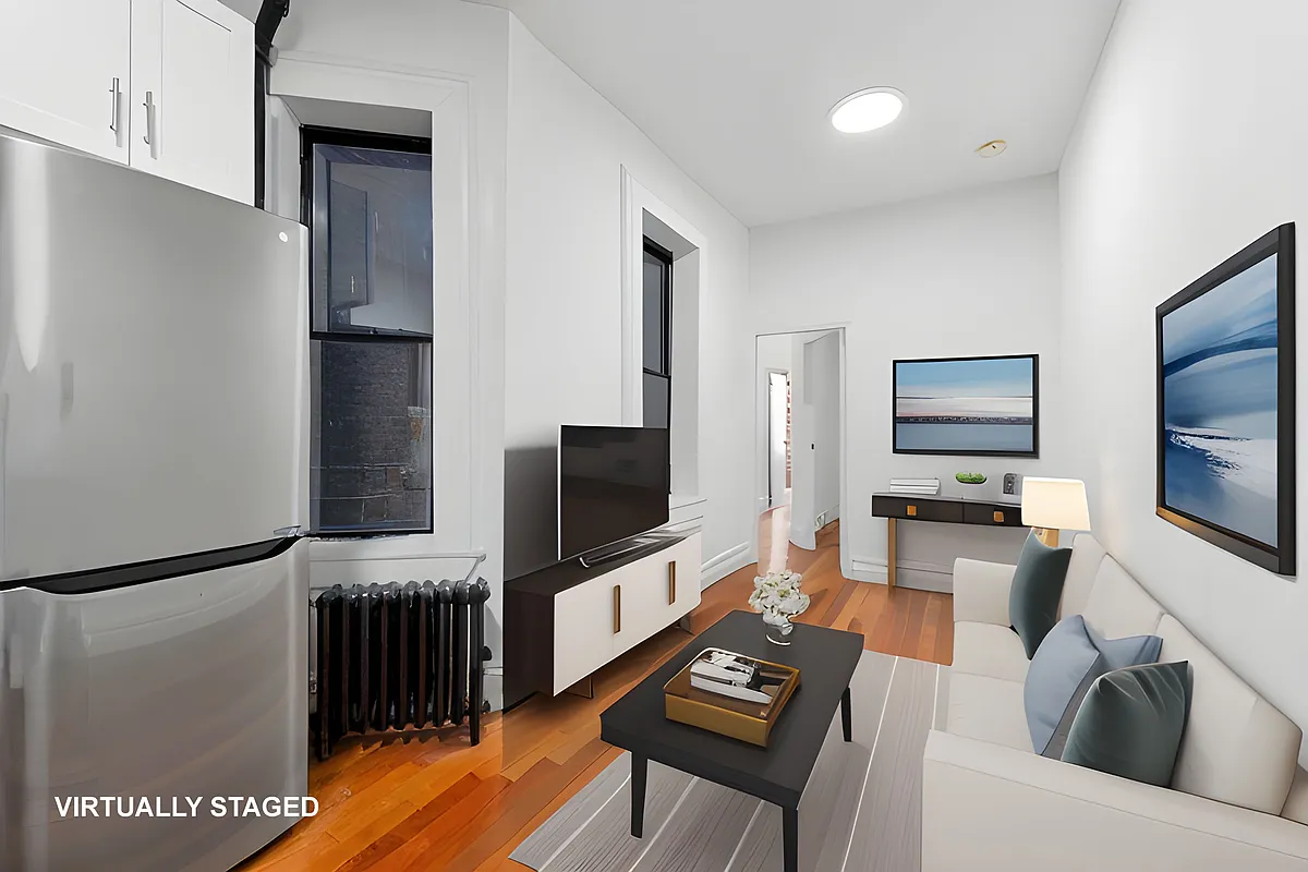 144 West 109th Street, Unit 5E Manhattan, NY 10025 - Photo 1 of 4 a living room with furniture and a flat screen tv