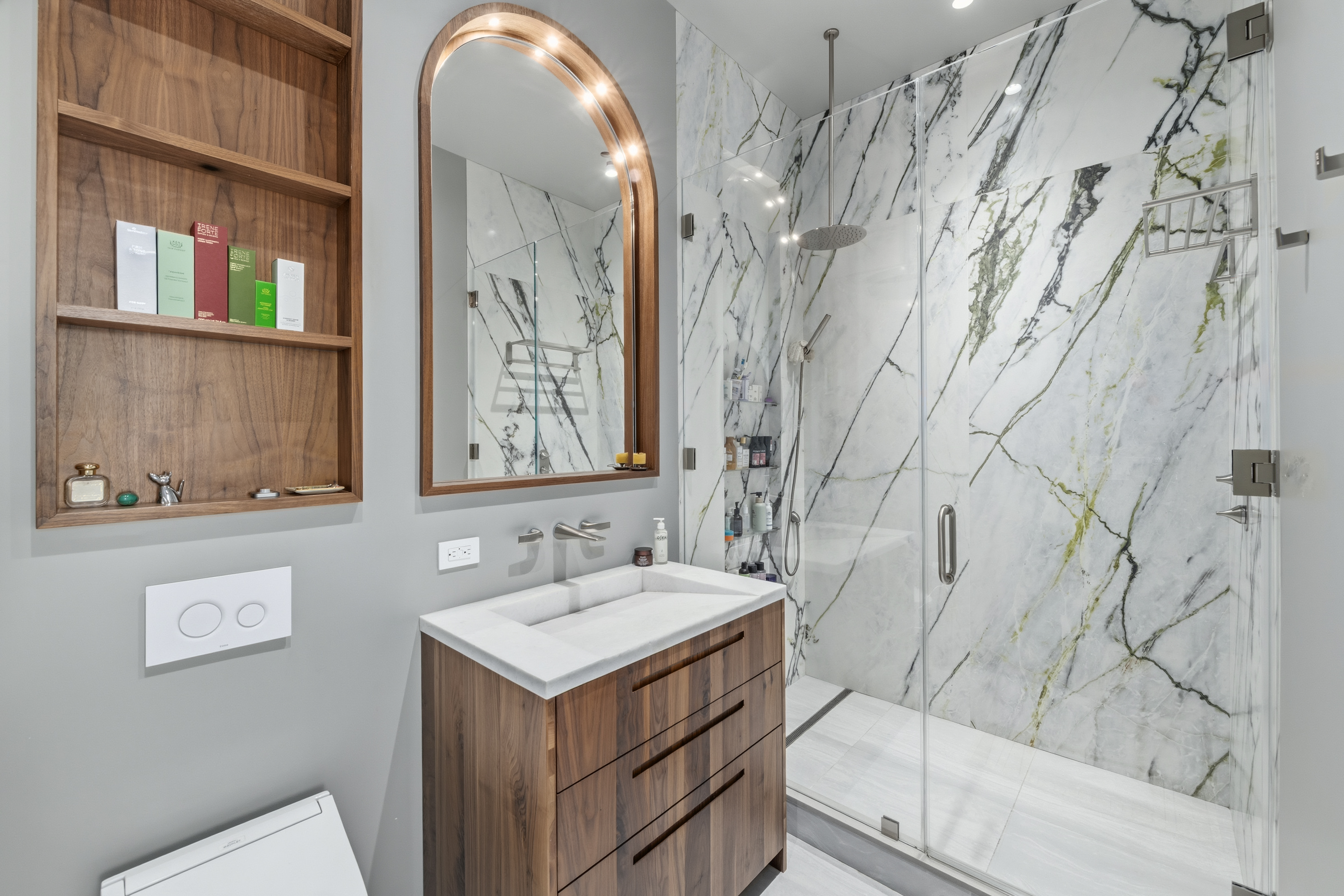 1 Great Jones St, Unit 2B Manhattan, NY 10012 - Photo 8 of 12 a bathroom with a sink and a mirror